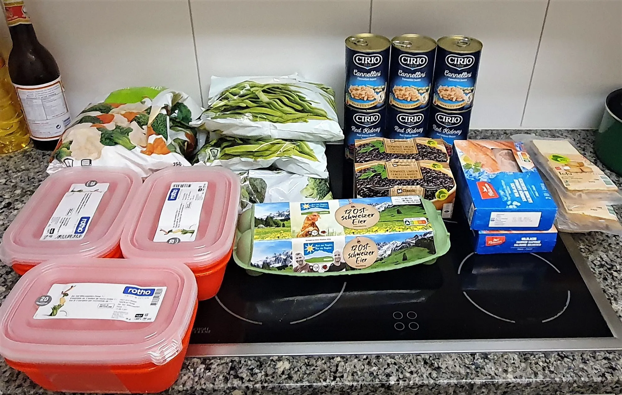 Groceries spread showing proteins, legumes, and vegetables for slow carb diet